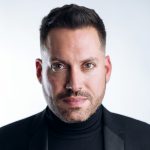Head and shoulders photo of Artistic Director Jean-Sebastien Vallee. He is wearing a black turtle neck and jacket and is looking directly at the camera.