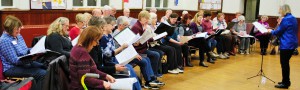 Janice Schulyer Ketchen conducts the Lynn Valley Voices in rehearsal